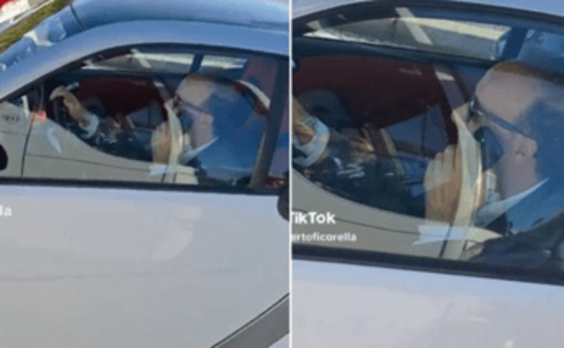 Al volante senza cintura e al telefono, bufera social su Roberto Benigni